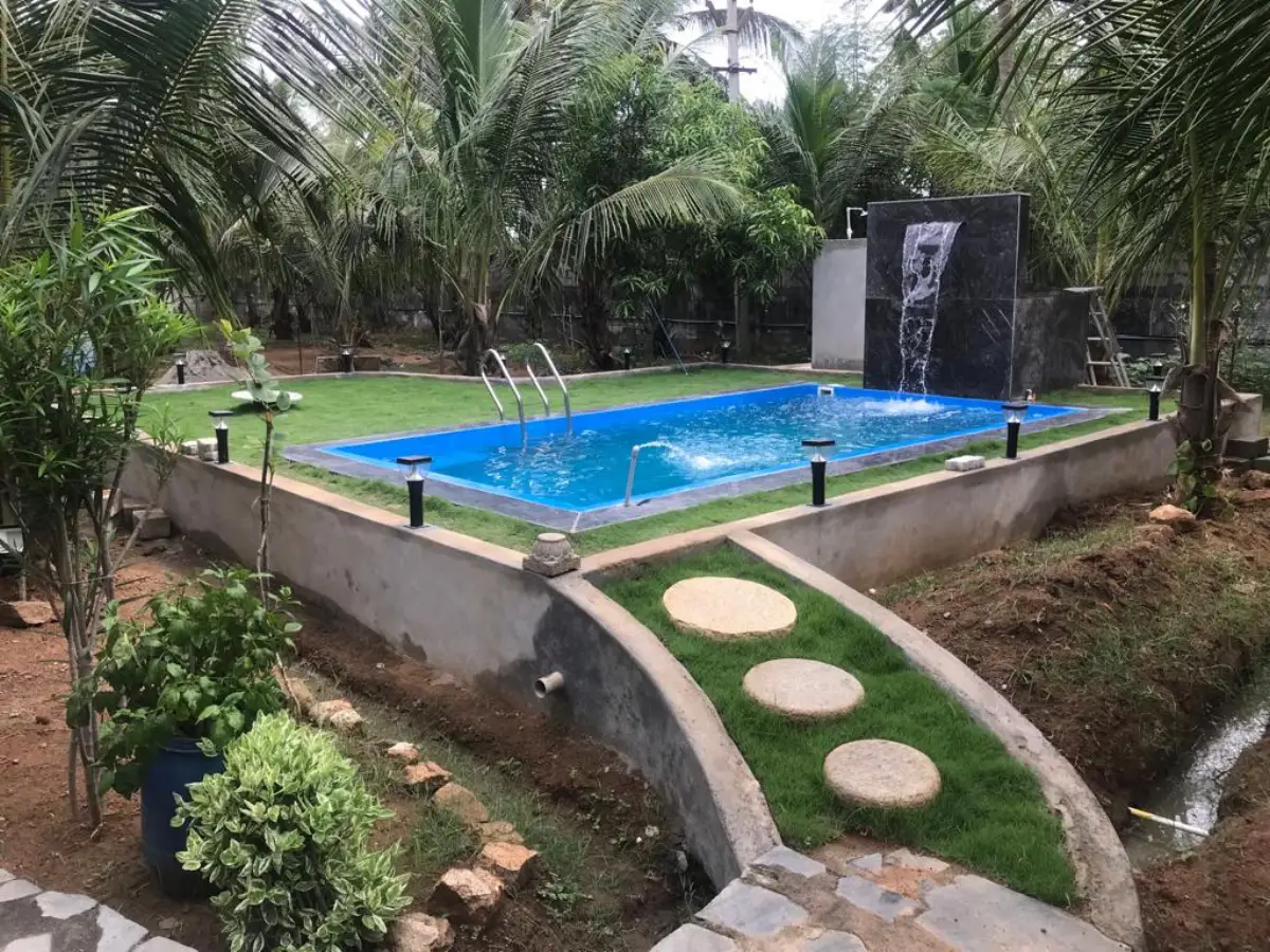 Garden Vinyl Liner Pool — Blue liner pool with stone stepping-stones & water feature