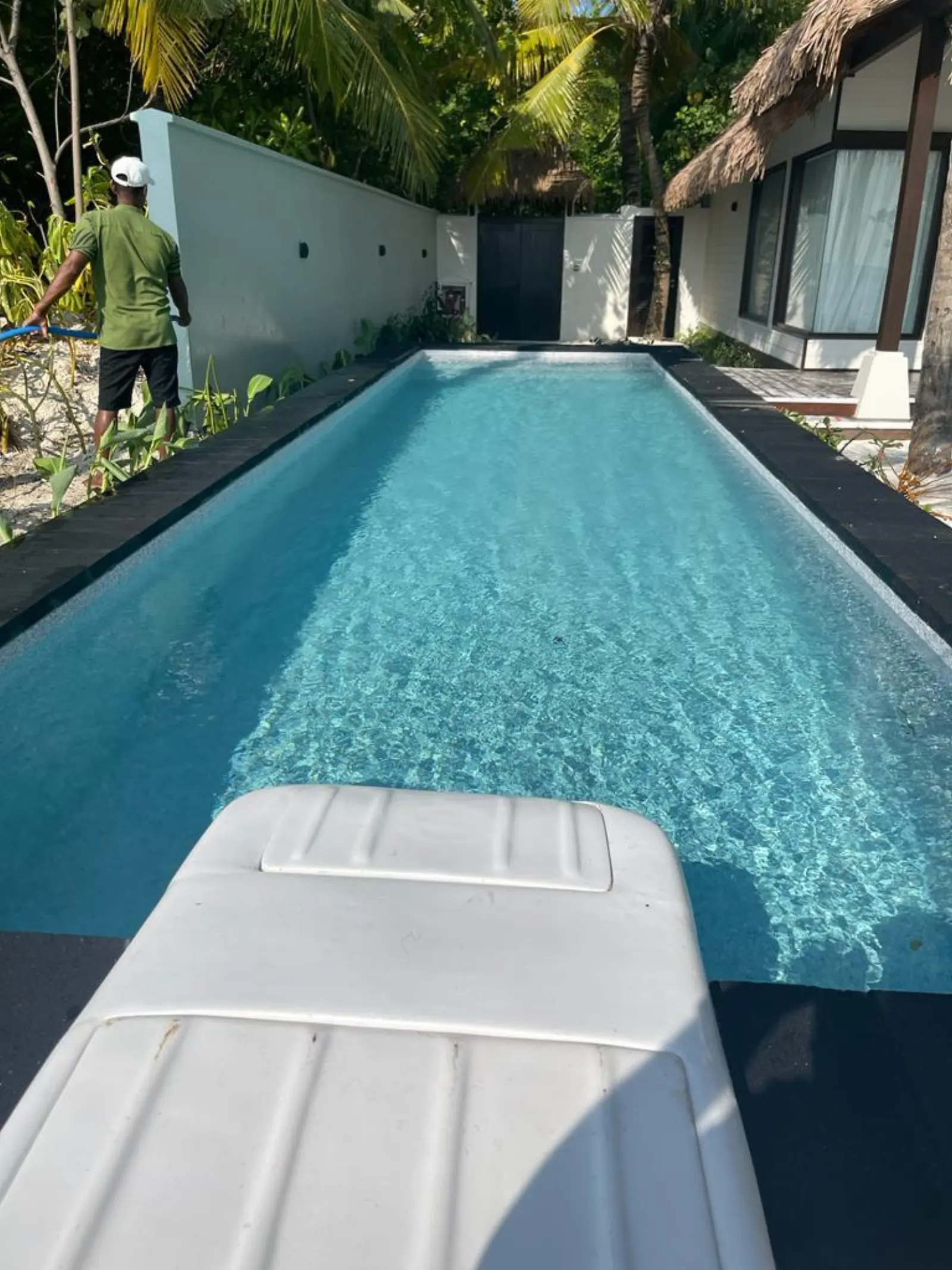 Rectangular Residence Pool — Clear blue water with dark stone coping