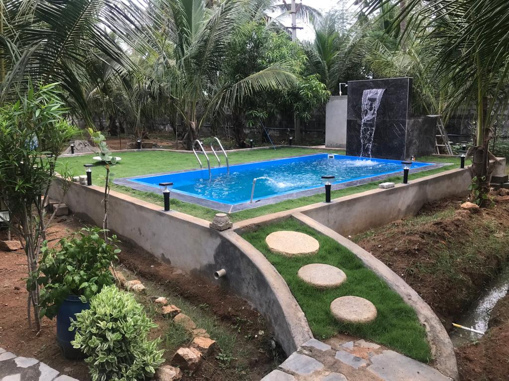 Garden Vinyl Liner Pool — Blue liner pool with stone stepping-stones & water feature