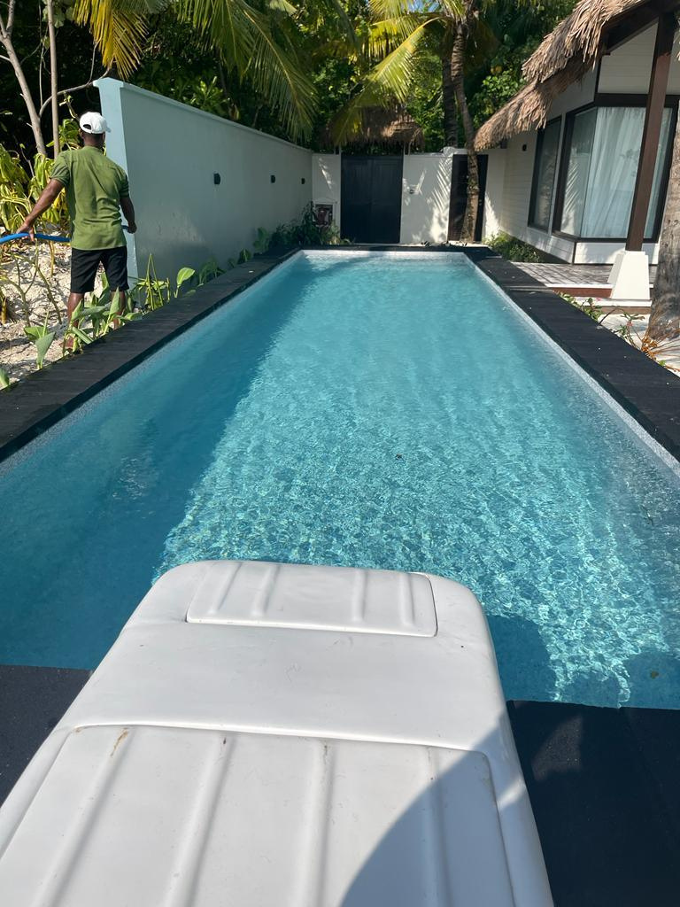 Rectangular Residence Pool — Clear blue water with dark stone coping