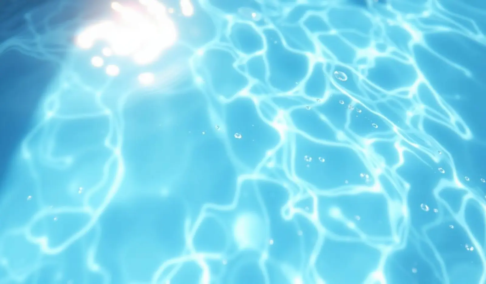 Clear, filtered pool water with sunlight ripples